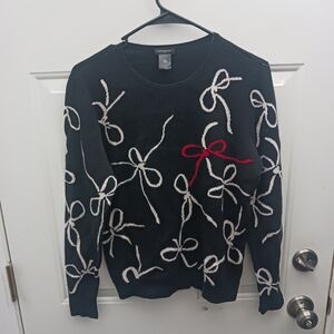 Black Sweater with White and Red Bow Design